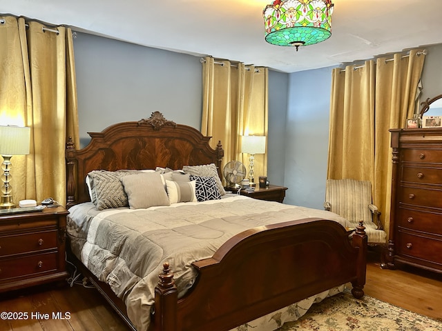 bedroom featuring dark wood-style floors