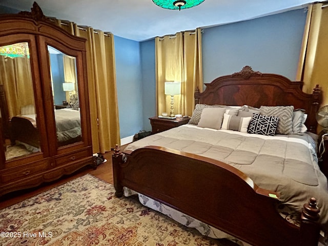 bedroom featuring wood finished floors