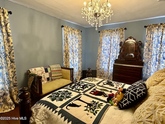 bedroom with a notable chandelier