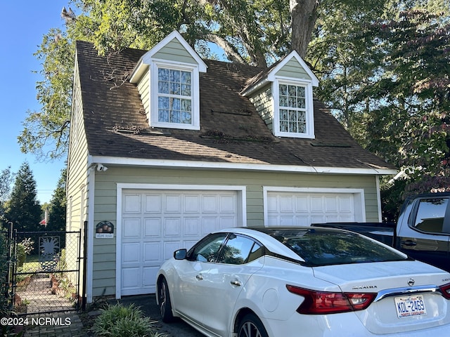 garage featuring fence