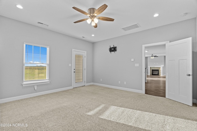 unfurnished bedroom with carpet and ceiling fan