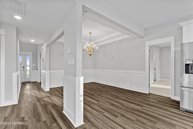 interior space featuring an inviting chandelier and dark hardwood / wood-style flooring