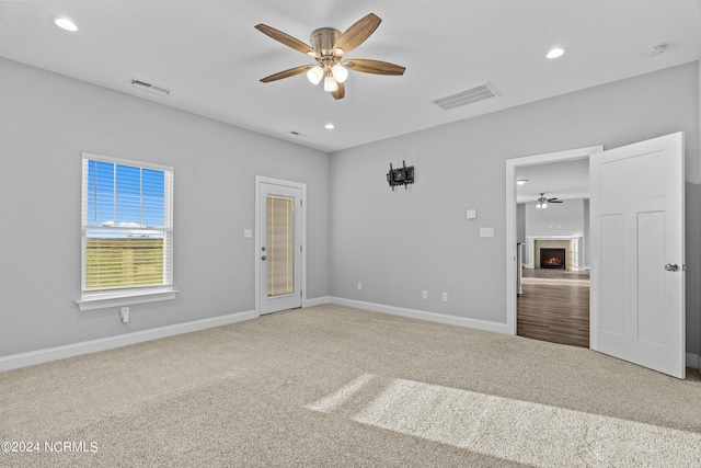 unfurnished bedroom with carpet flooring and ceiling fan