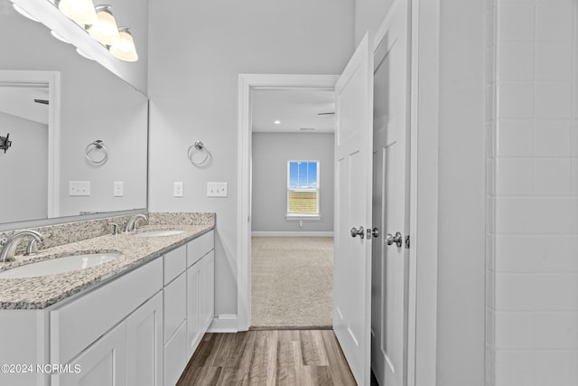 bathroom featuring hardwood / wood-style flooring and vanity