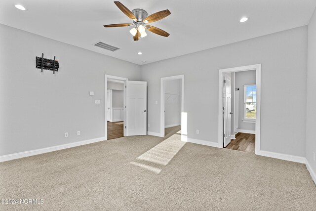 hallway with carpet floors