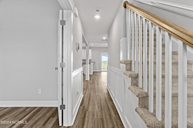 corridor featuring dark hardwood / wood-style floors