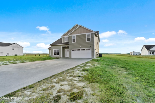 front facade with a garage and a front yard