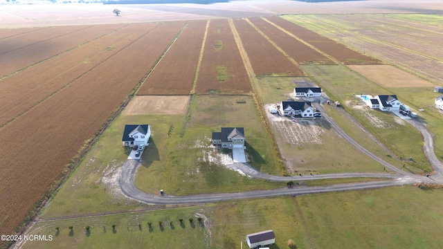 birds eye view of property with a rural view