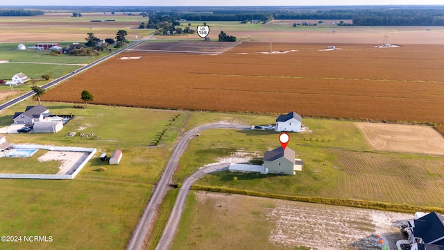 birds eye view of property with a rural view