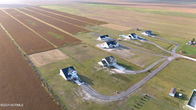 birds eye view of property with a rural view