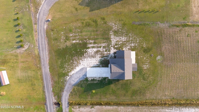 birds eye view of property featuring a rural view