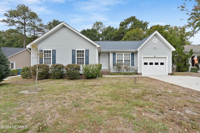 ranch-style house with a front yard and a garage