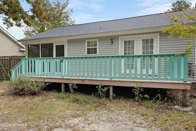 back of property with a deck