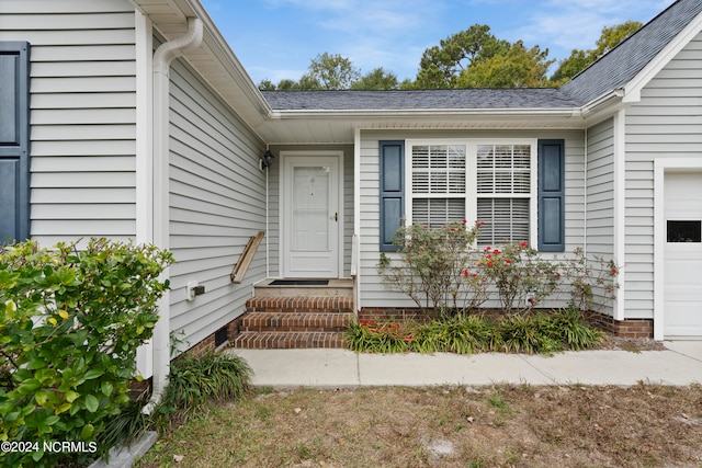 property entrance featuring a garage