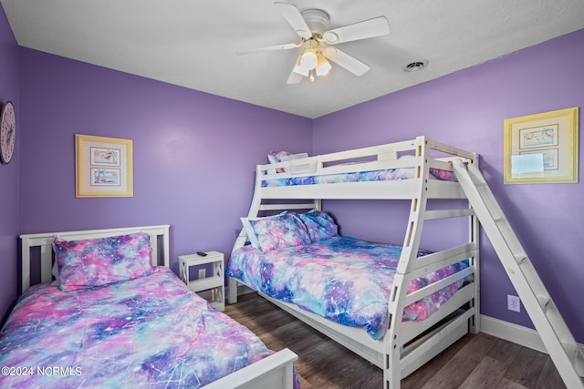 bedroom featuring ceiling fan and dark hardwood / wood-style floors