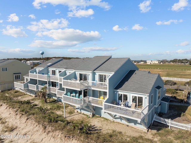 rear view of house featuring a balcony