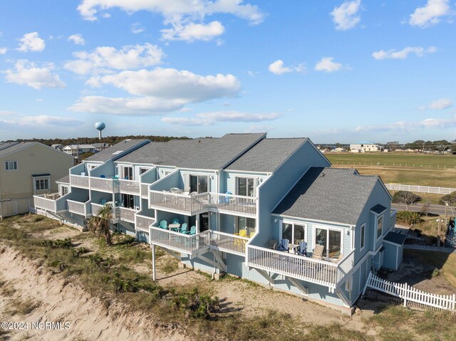 503 Pelican Ct Unit 503, Kure Beach, NC 28449 - back of property with fence and a shingled roof