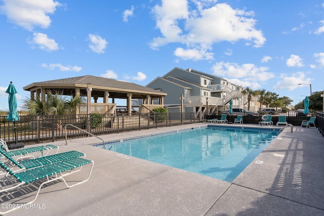 view of swimming pool with a patio