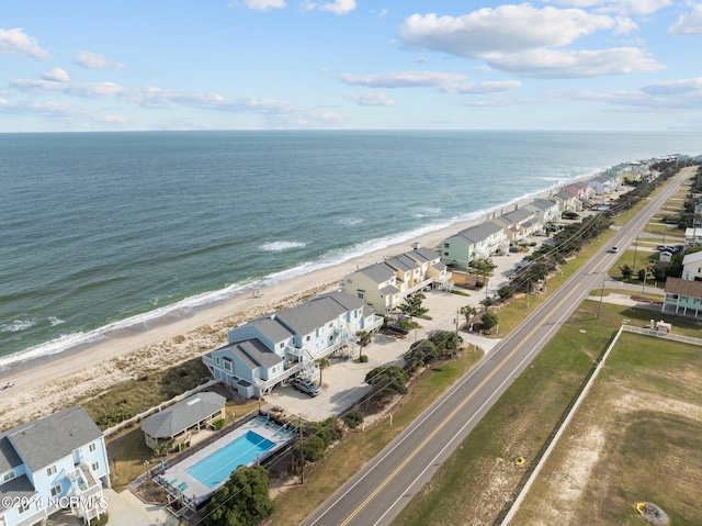 aerial view featuring a water view and a beach view