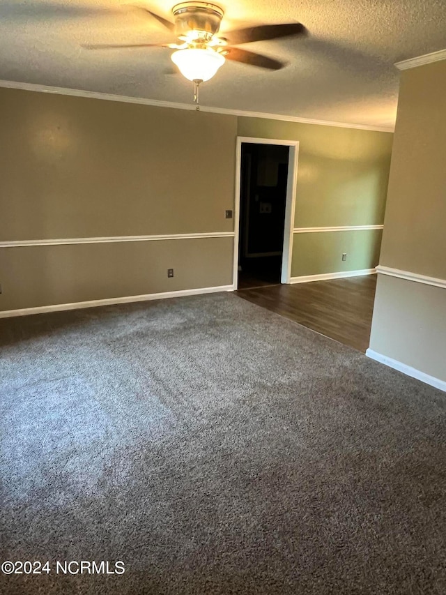 carpeted spare room featuring ceiling fan, a textured ceiling, and ornamental molding