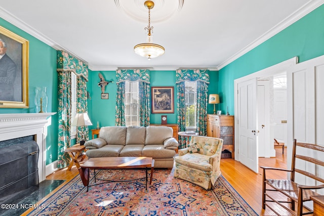 living room featuring ornamental molding and hardwood / wood-style floors