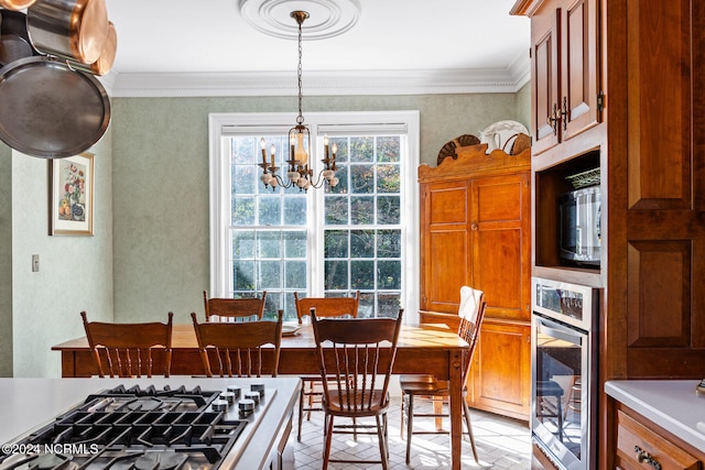 dining space featuring an inviting chandelier and ornamental molding