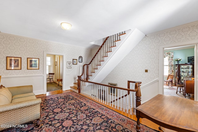 living room with crown molding and hardwood / wood-style floors