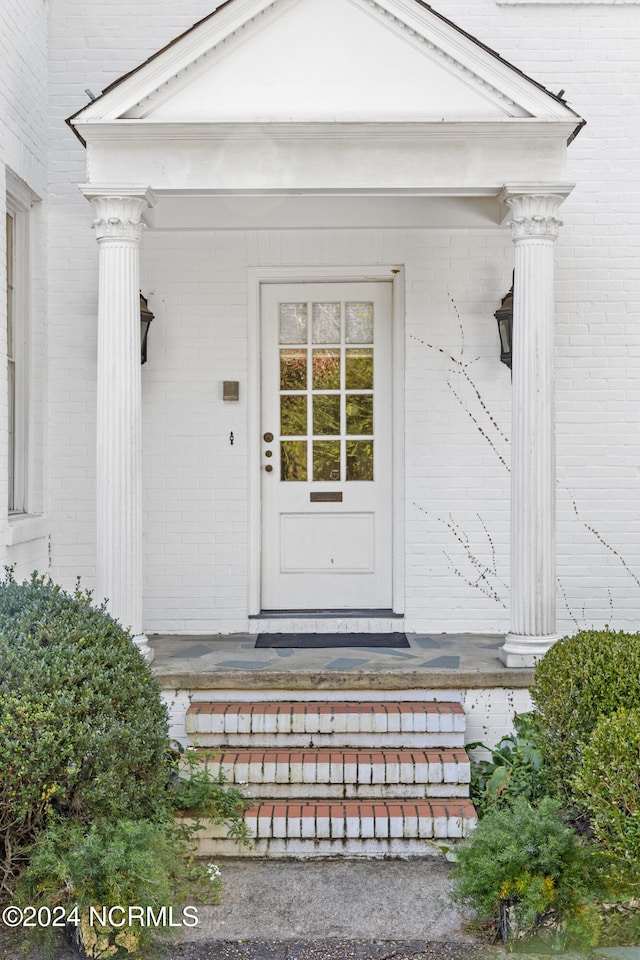 doorway to property featuring covered porch