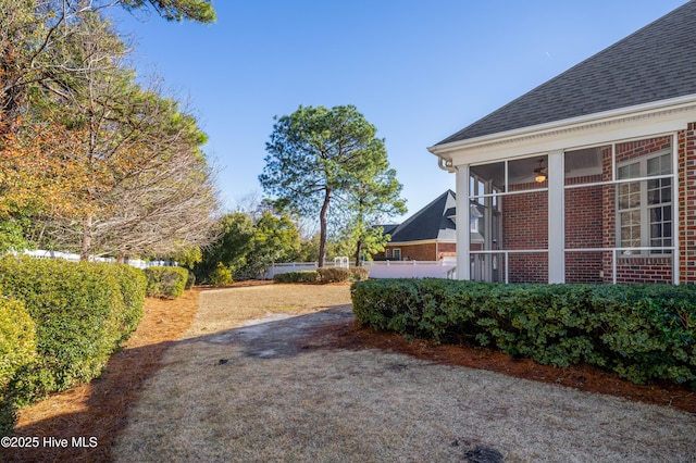 view of yard featuring a sunroom