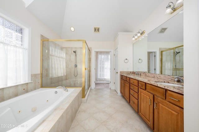 bathroom featuring vanity, lofted ceiling, and separate shower and tub