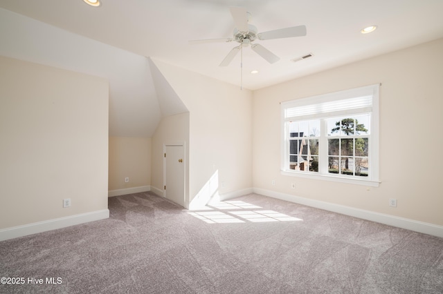 bonus room featuring ceiling fan, light colored carpet, and lofted ceiling