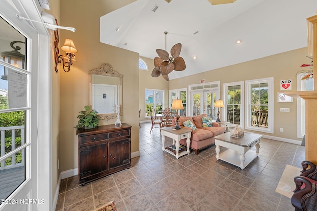 living room with high vaulted ceiling, tile patterned floors, and ceiling fan