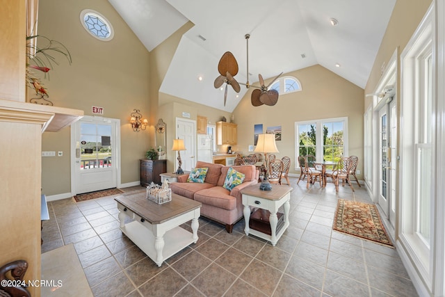 living room with tile patterned flooring, high vaulted ceiling, and ceiling fan