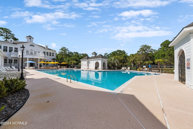 view of swimming pool with a patio