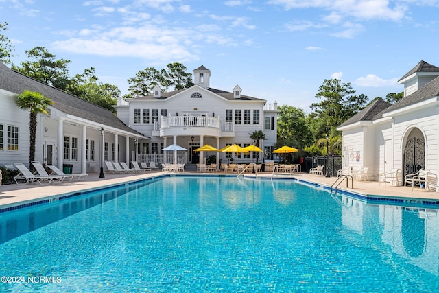 view of pool featuring a patio