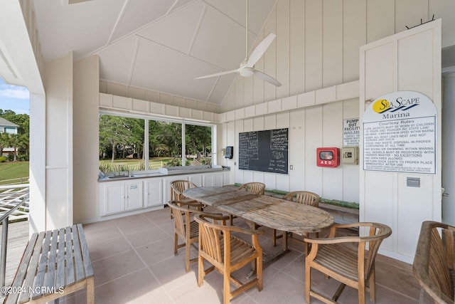 sunroom / solarium with a healthy amount of sunlight, sink, and ceiling fan