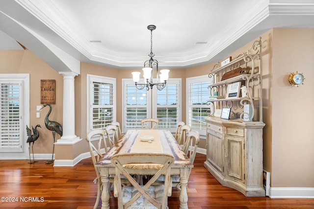 dining space featuring ornamental molding, a chandelier, and hardwood / wood-style floors