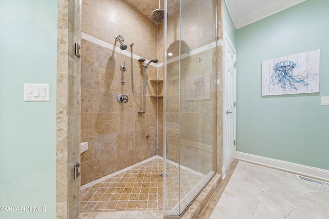 bathroom featuring crown molding and a shower with shower door