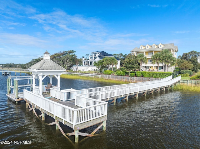 dock area featuring a gazebo and a water view