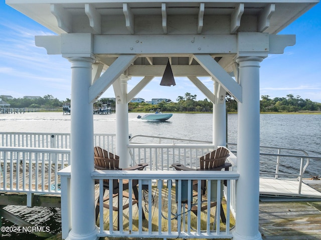 exterior space featuring a deck with water view