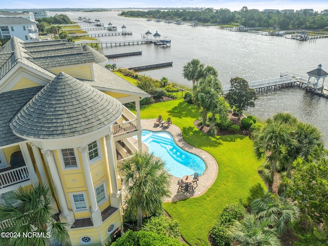 birds eye view of property with a water view