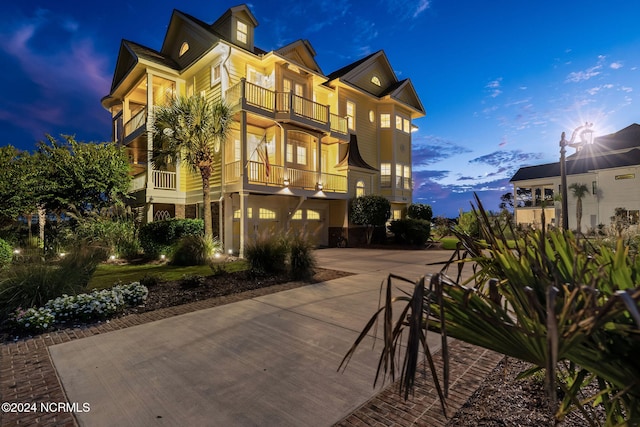 outdoor building at dusk with a garage