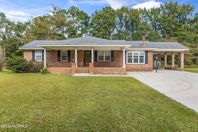 ranch-style home with a front yard and a carport