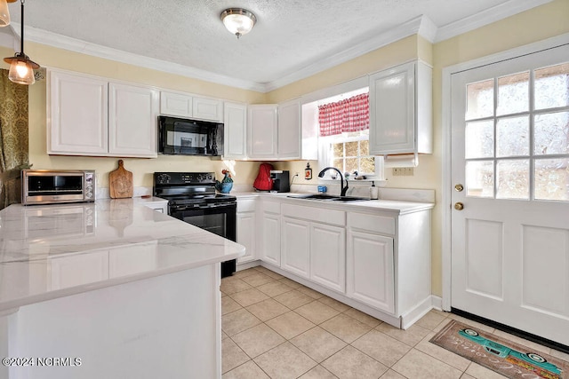 kitchen with white cabinets, pendant lighting, a healthy amount of sunlight, and black appliances