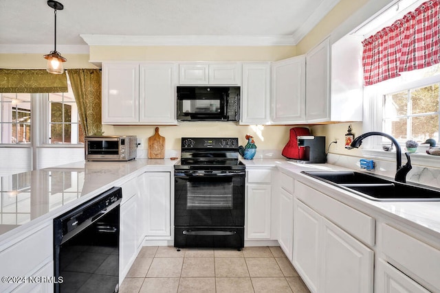 kitchen with sink, a wealth of natural light, white cabinetry, and black appliances