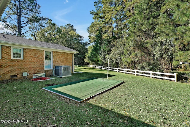 view of yard featuring central AC unit