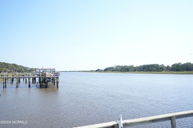 view of dock featuring a water view and boat lift
