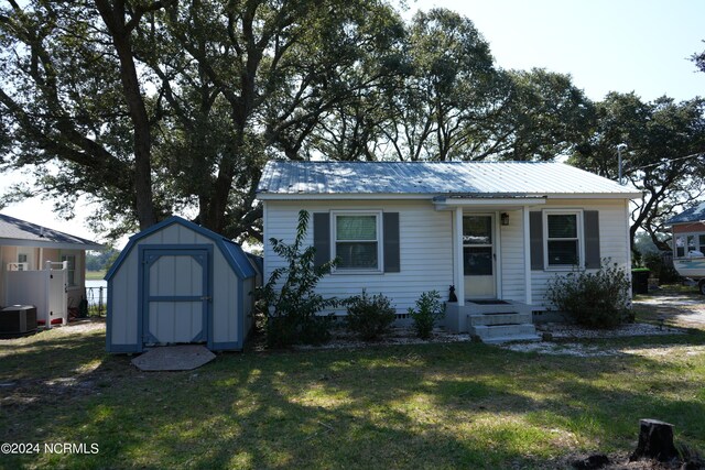 back of property featuring a yard and a deck