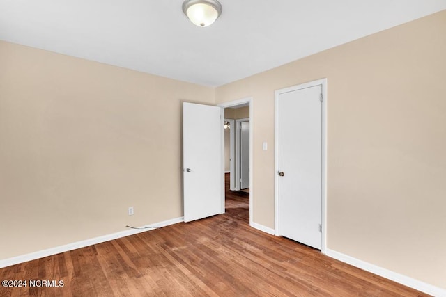 empty room featuring wood-type flooring