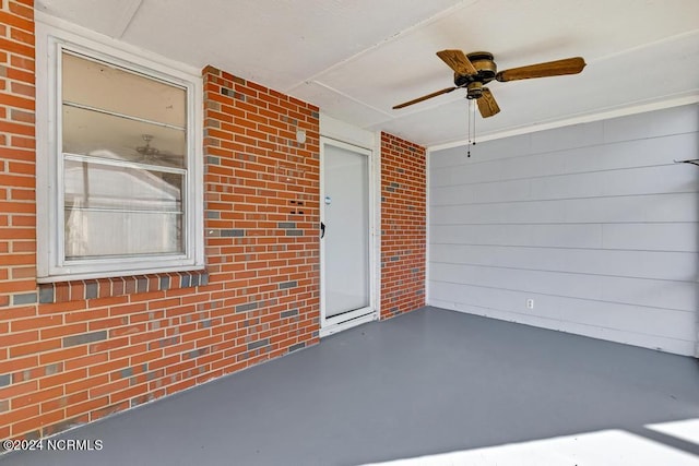 exterior space featuring ceiling fan